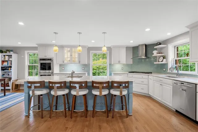a large kitchen with a table and chairs