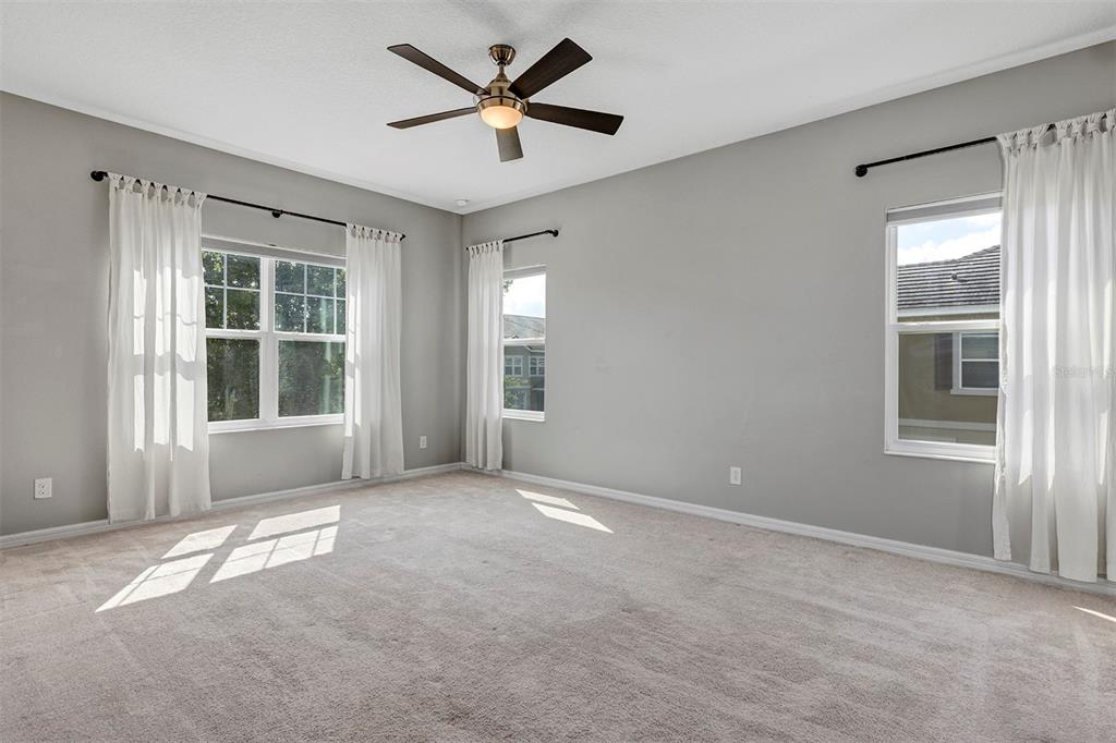 7644 Ripplepointe Way Windermere, FL 34786 - Photo 23 of 52 a view of an empty room with a window