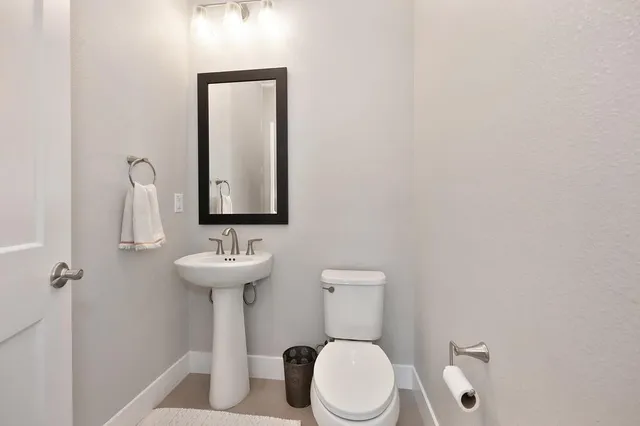 a patio with a table and chairs