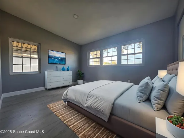 a bedroom with a bed and window