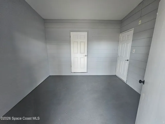 an empty room with a empty space and window