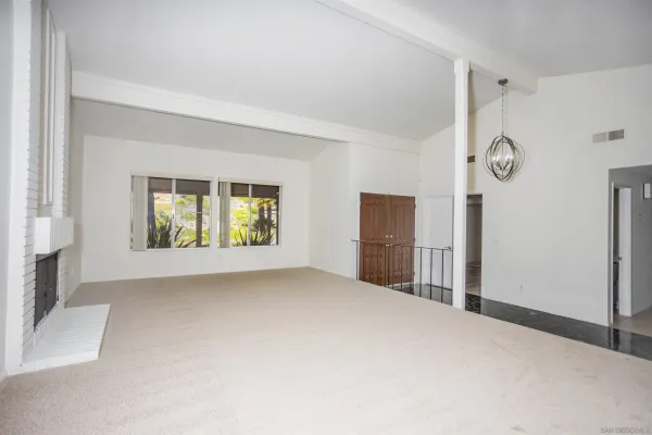 a view of empty room with windows