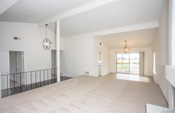 a view of a big room with windows