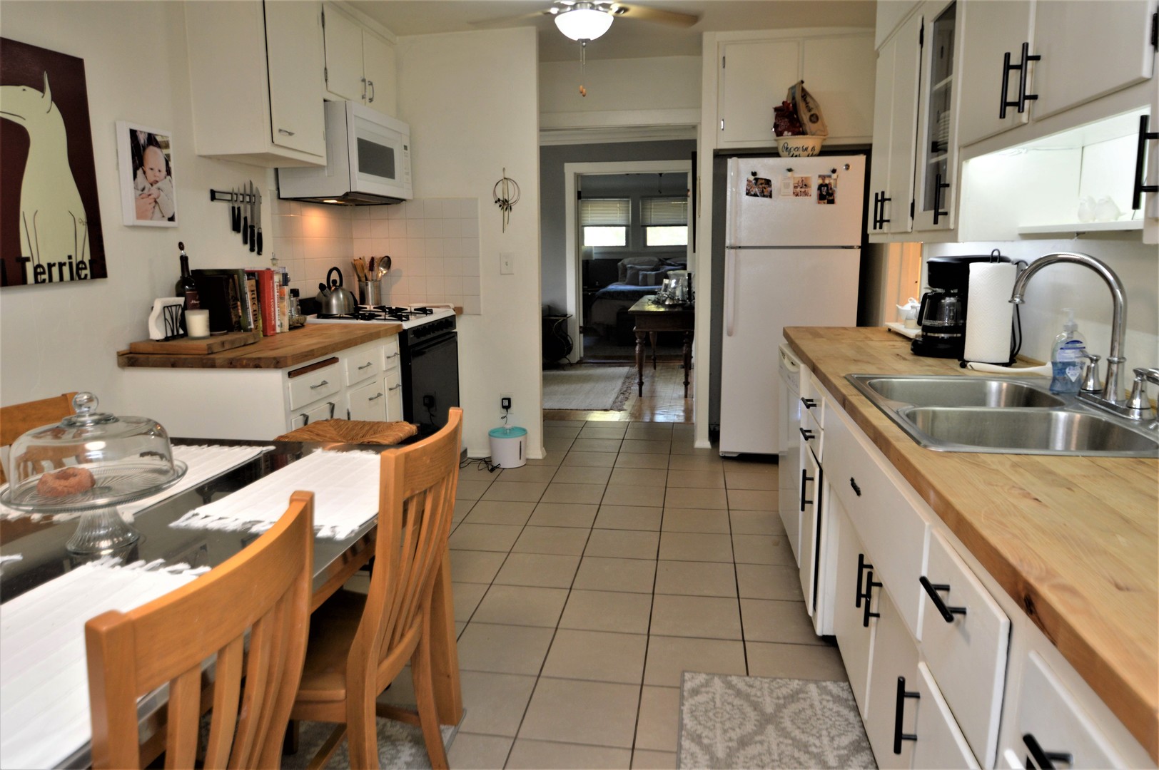 111 Groveland Avenue Riverside, IL 60546 - Photo 20 of 40 a kitchen with stainless steel appliances granite countertop a sink and a stove