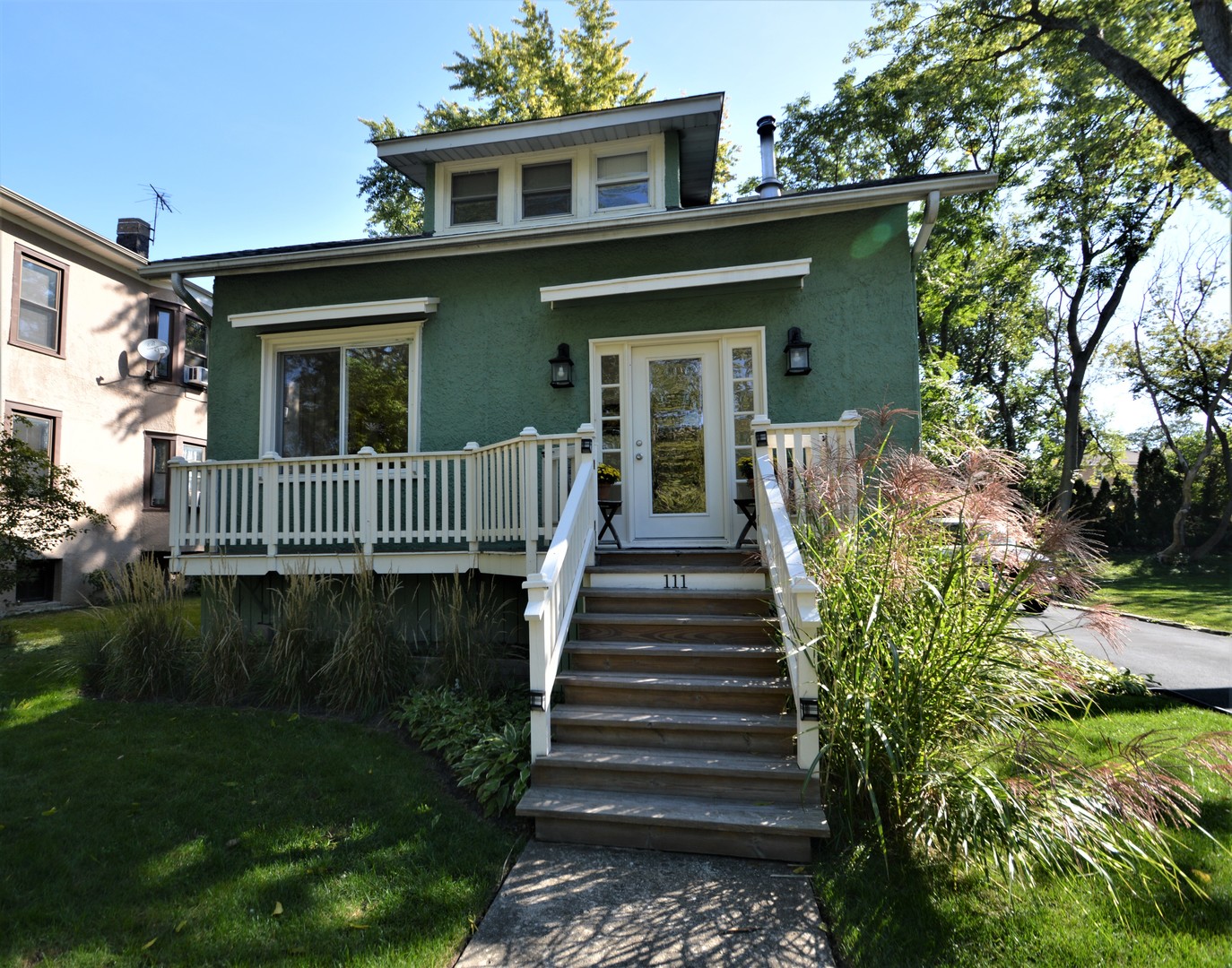 111 Groveland Avenue Riverside, IL 60546 - Photo 2 of 40 a front view of a house with a yard