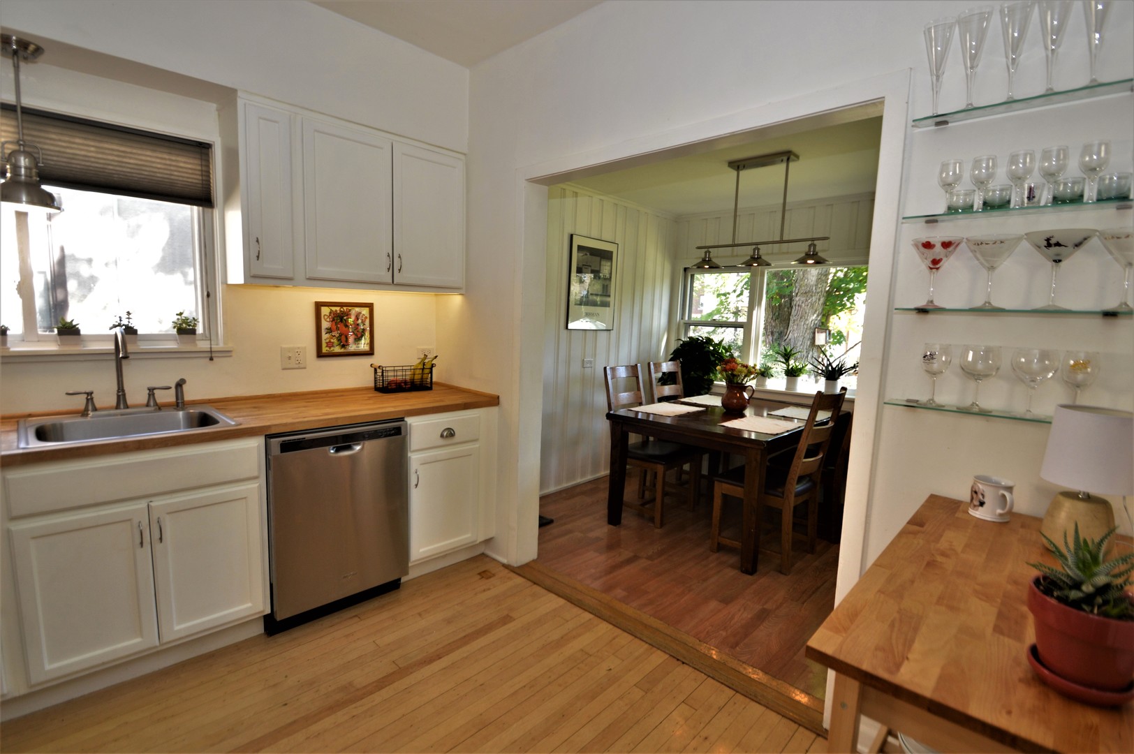 111 Groveland Avenue Riverside, IL 60546 - Photo 9 of 40 a kitchen with a sink cabinets and wooden floor