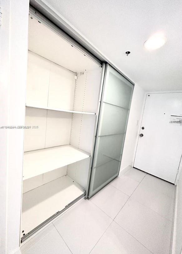 100 Lincoln Road, Unit 526 Miami Beach, FL 33139 - Photo 4 of 19 a view of walk in closet with empty racks