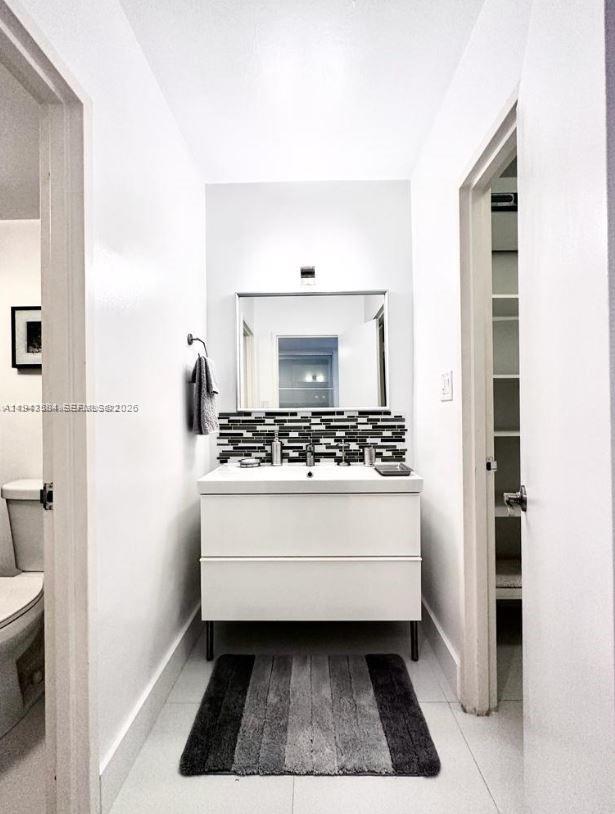 100 Lincoln Road, Unit 526 Miami Beach, FL 33139 - Photo 6 of 19 a bathroom with a sink and a mirror