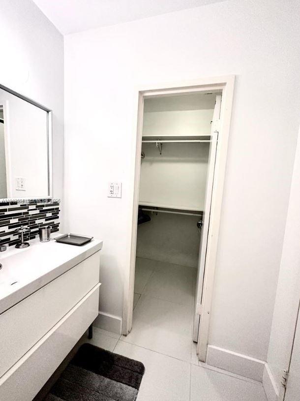 100 Lincoln Road, Unit 526 Miami Beach, FL 33139 - Photo 7 of 19 a bathroom with a sink and a mirror
