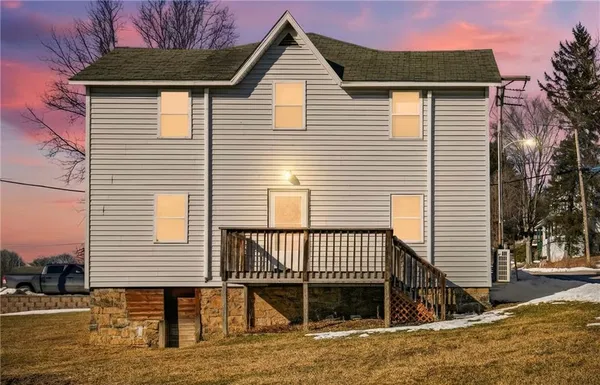 a view of a house with a yard and front view of a house