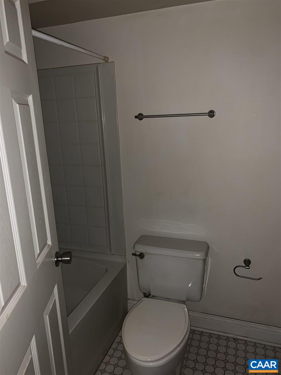 118 Turtle Creek Road, Unit 1 Charlottesville, VA 22901 - Photo 6 of 7 a white toilet sitting next to a shower