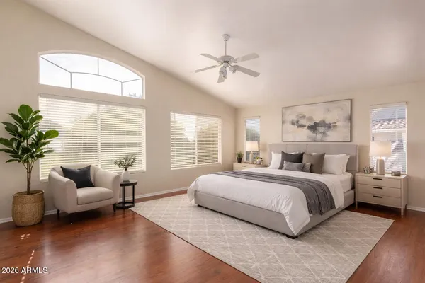 a bedroom with a large bed and a couch