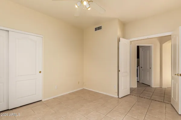a view of an empty room and closet area