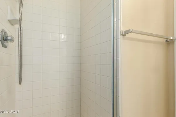 a bathroom with a glass shower door