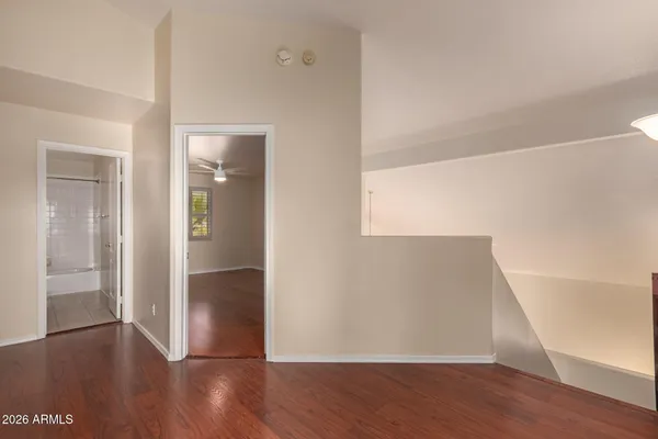 a view of hallway with wooden floor