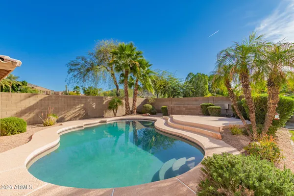 a view of a swimming pool with a patio
