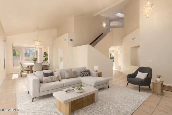 a living room with furniture and a large window