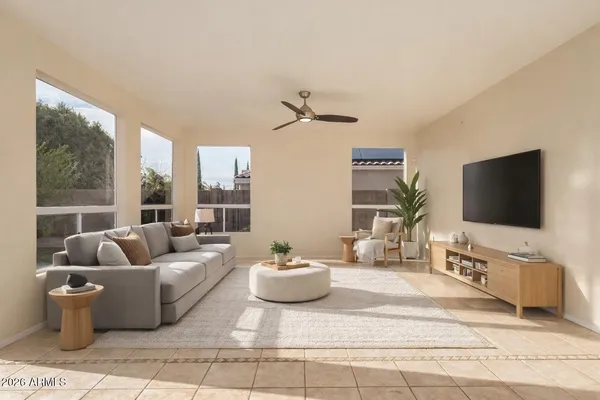 a living room with furniture and a flat screen tv