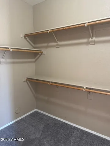 a view of an empty walk in closet
