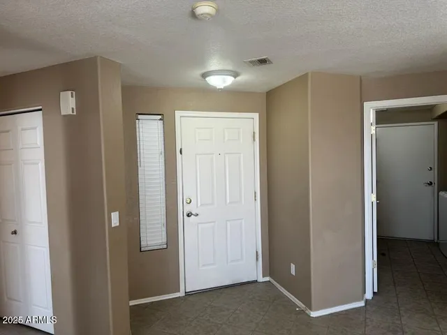 a view of a hallway with closet area