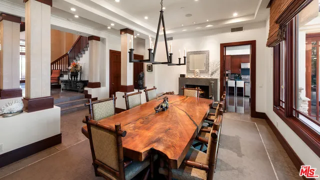 a dining room with furniture and window
