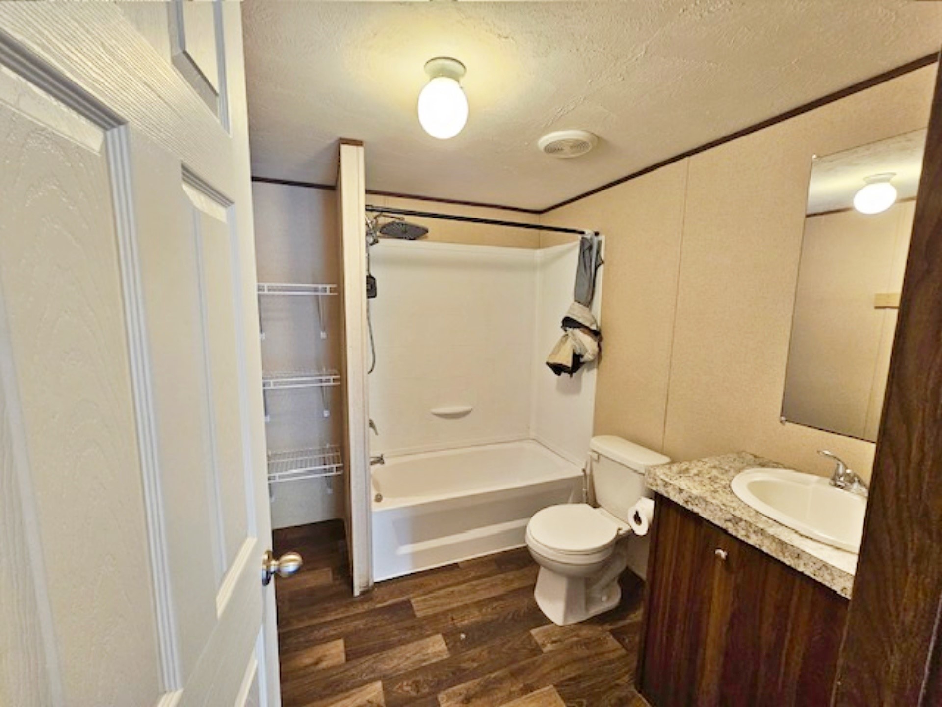 1032 Reeves Road Garwood, TX 77442 - Photo 13 of 29 a bathroom with a granite countertop sink toilet and shower