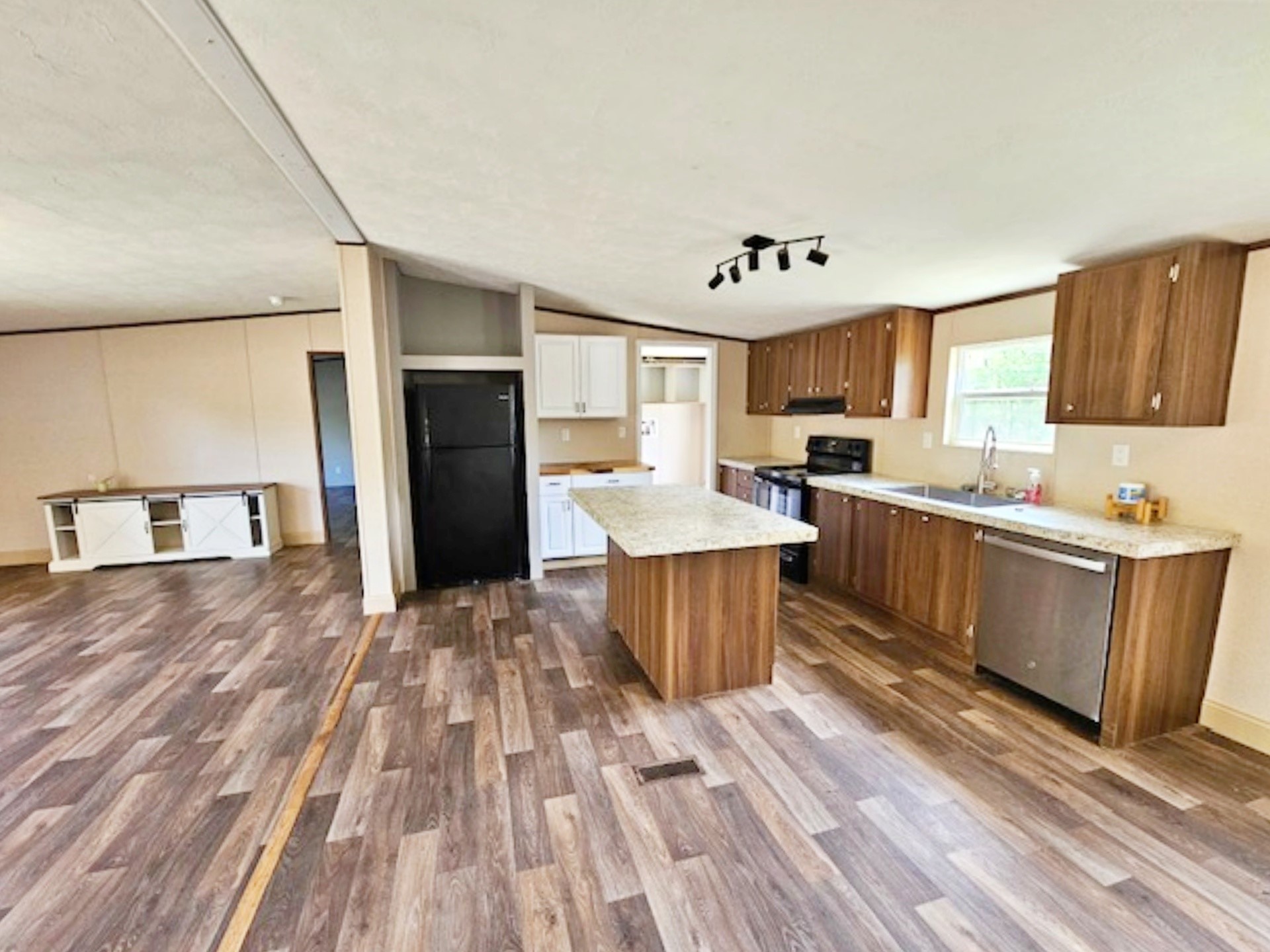 1032 Reeves Road Garwood, TX 77442 - Photo 5 of 29 a kitchen with stainless steel appliances a sink a stove a refrigerator cabinets and a window