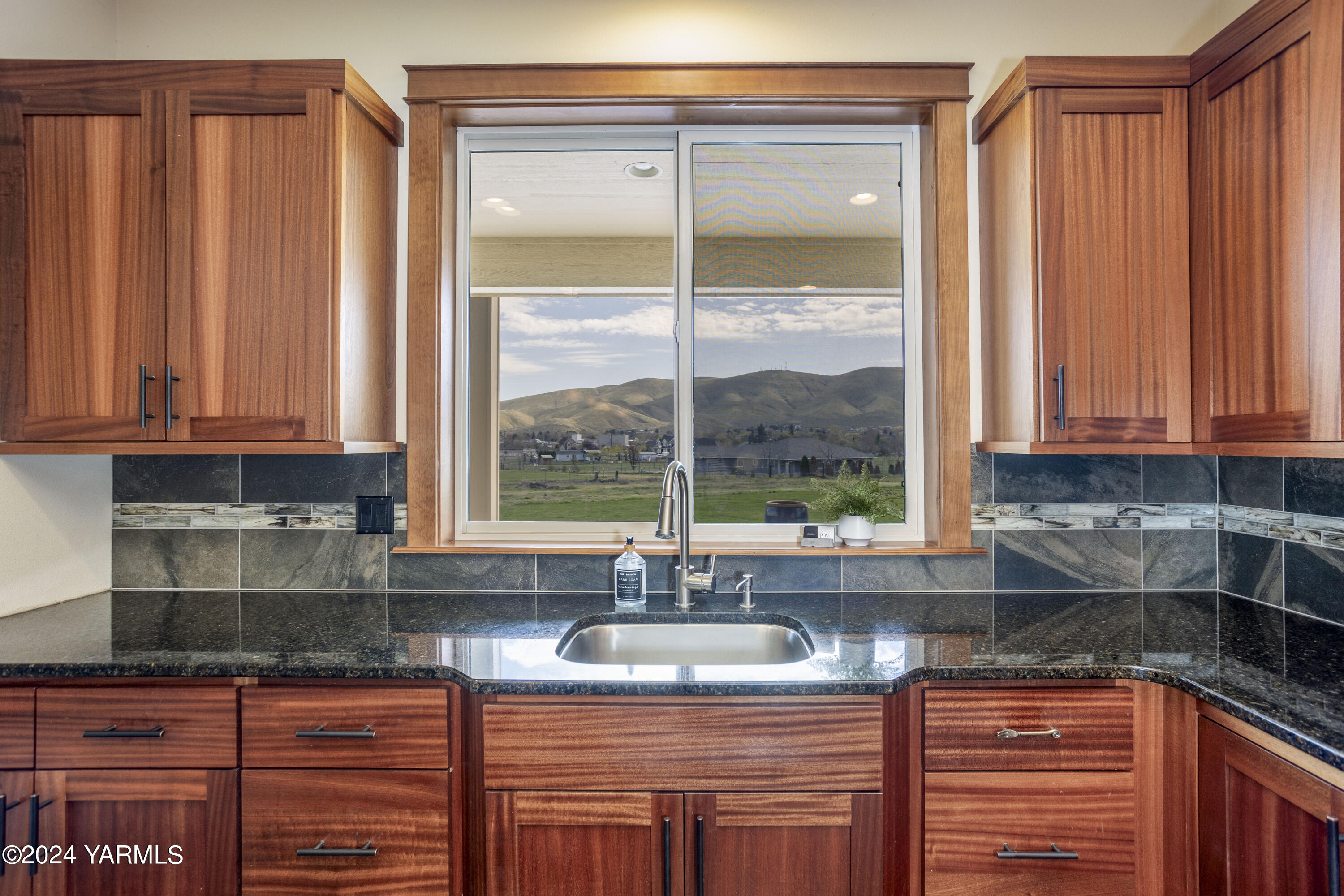7115 1396 Private Road Southwest Prosser, WA 99350 - Photo 12 of 47 a kitchen with stainless steel appliances granite countertop a sink and a window