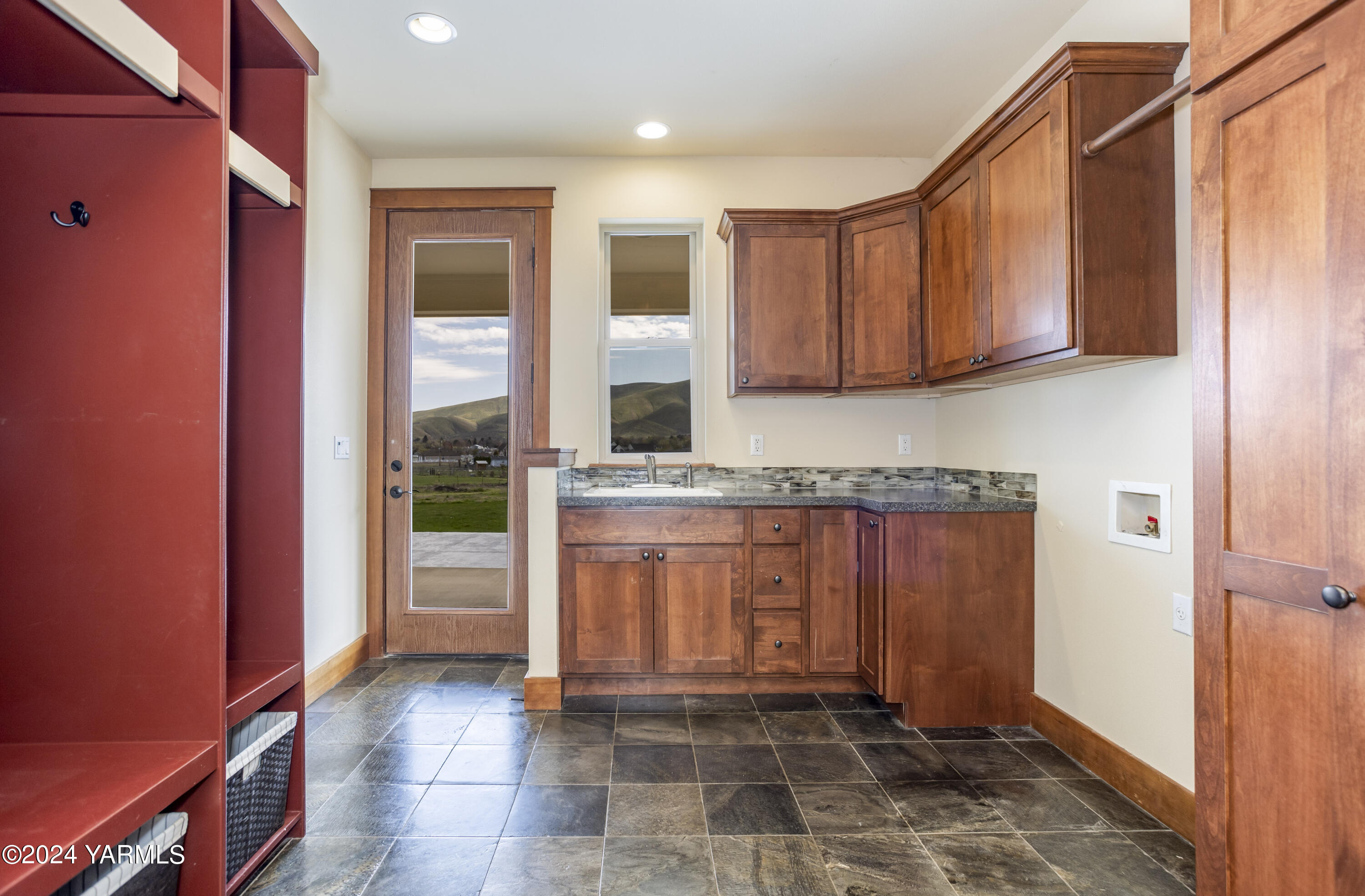 7115 1396 Private Road Southwest Prosser, WA 99350 - Photo 14 of 47 a view of a refrigerator and window in a kitchen