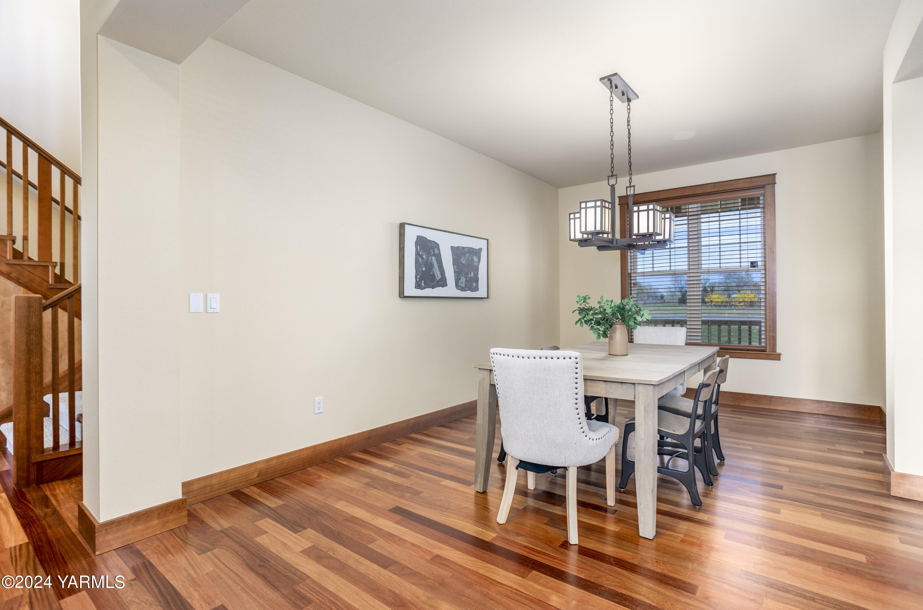 7115 1396 Private Road Southwest Prosser, WA 99350 - Photo 15 of 47 a view of a dining room with furniture window and wooden floor