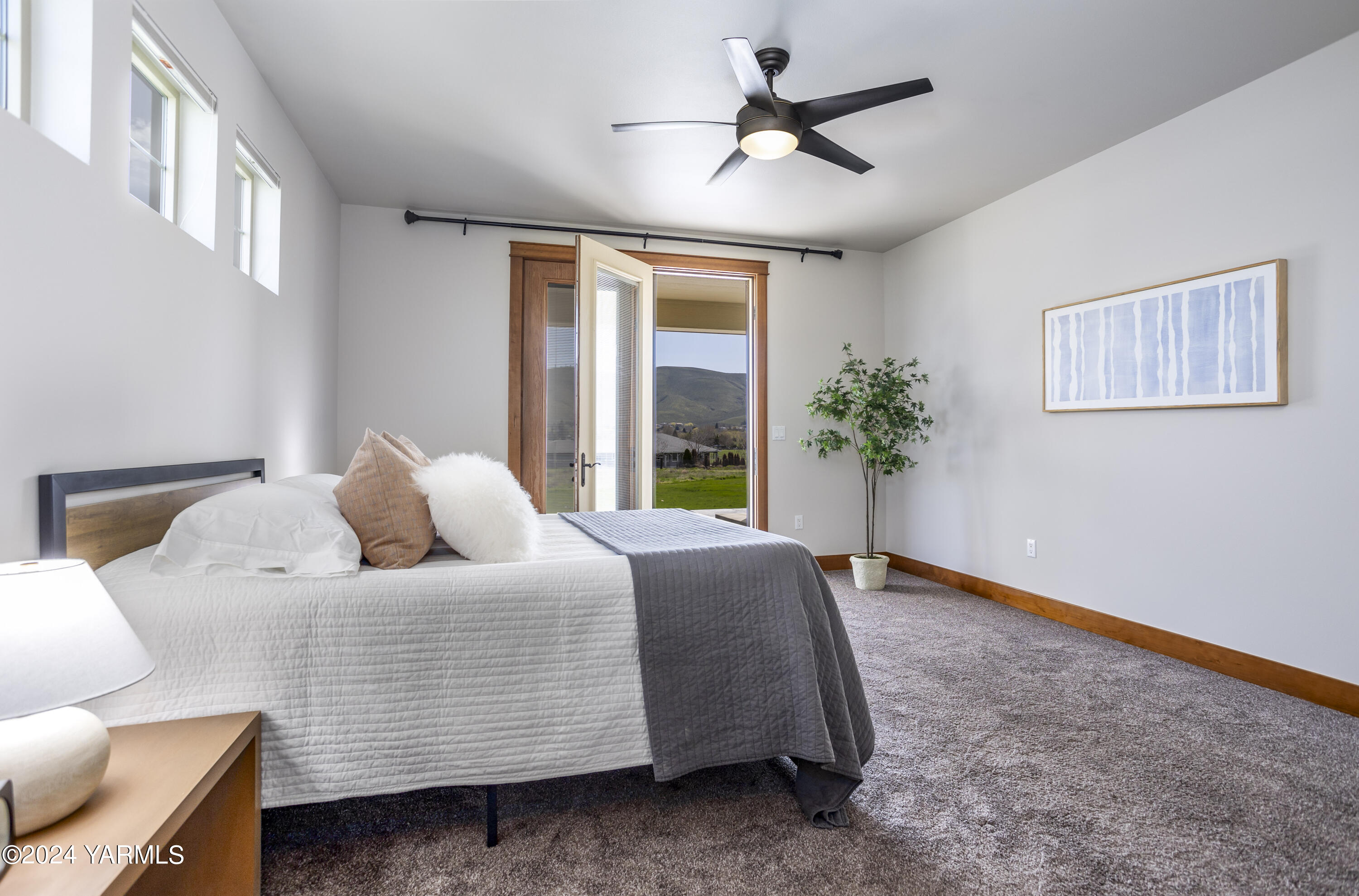 7115 1396 Private Road Southwest Prosser, WA 99350 - Photo 17 of 47 a bedroom with a bed and a chandelier