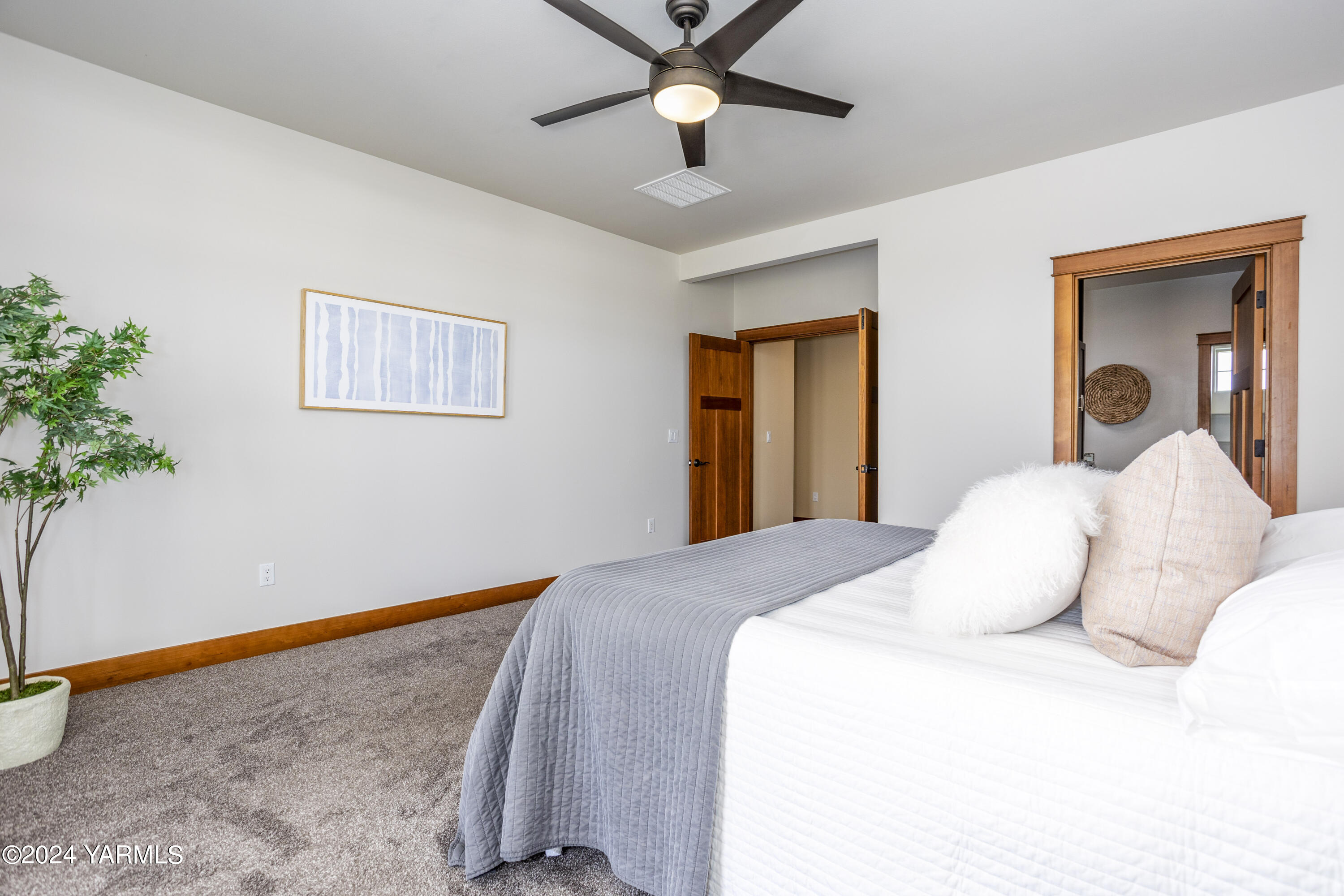 7115 1396 Private Road Southwest Prosser, WA 99350 - Photo 18 of 47 a bedroom with a bed and a chandelier