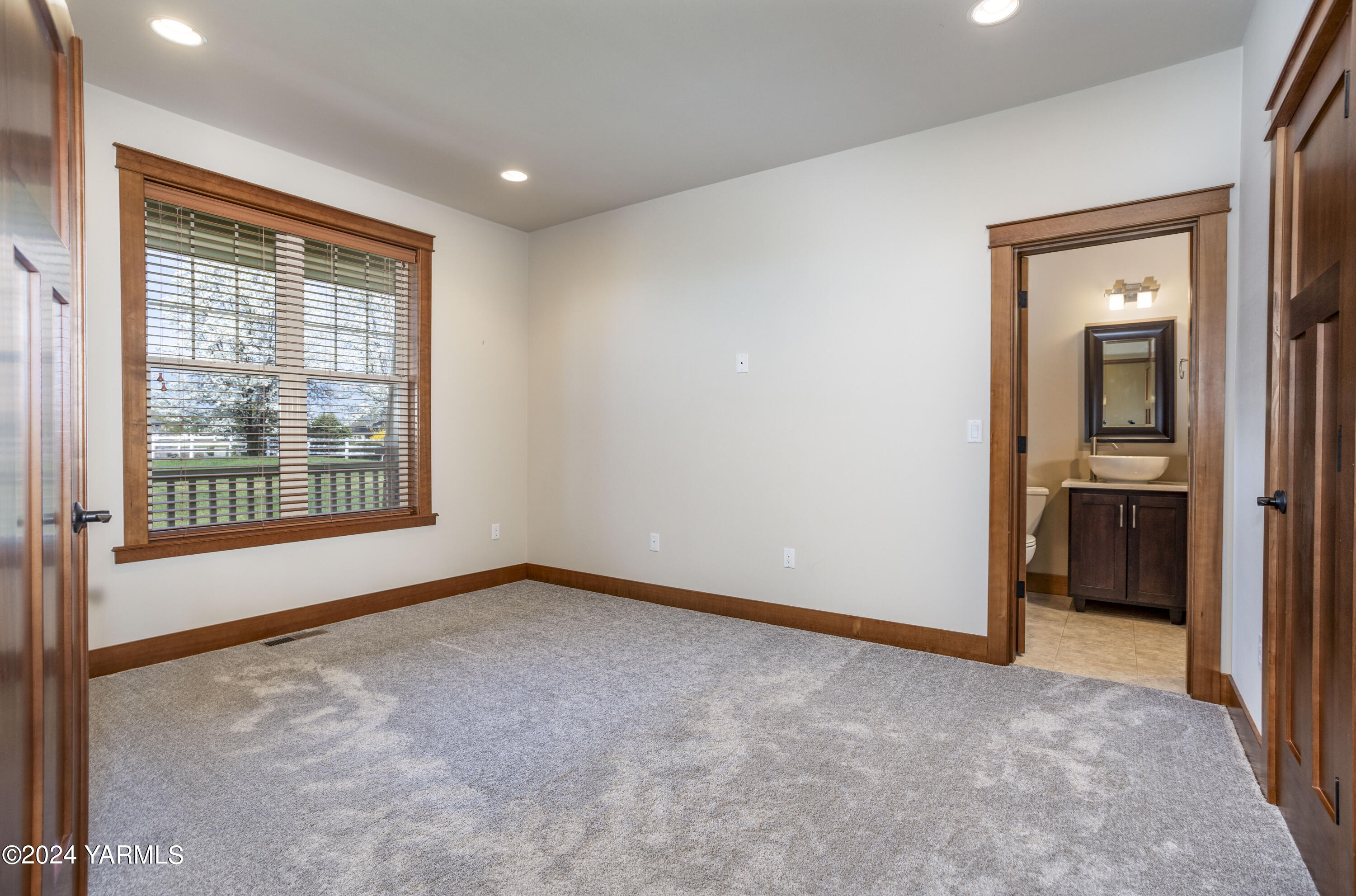 7115 1396 Private Road Southwest Prosser, WA 99350 - Photo 23 of 47 an empty room with a window