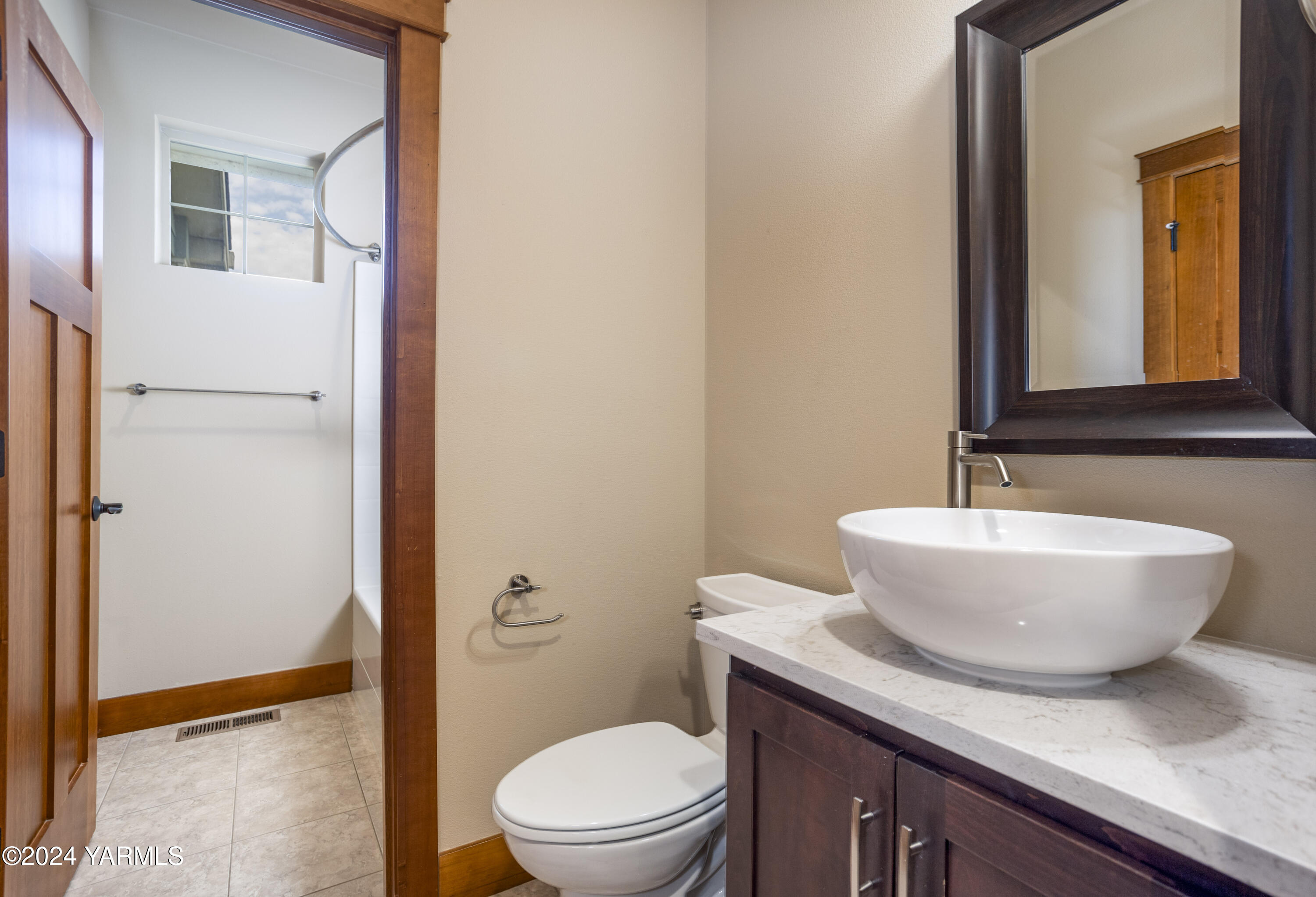 7115 1396 Private Road Southwest Prosser, WA 99350 - Photo 24 of 47 a bathroom with a toilet a sink and mirror