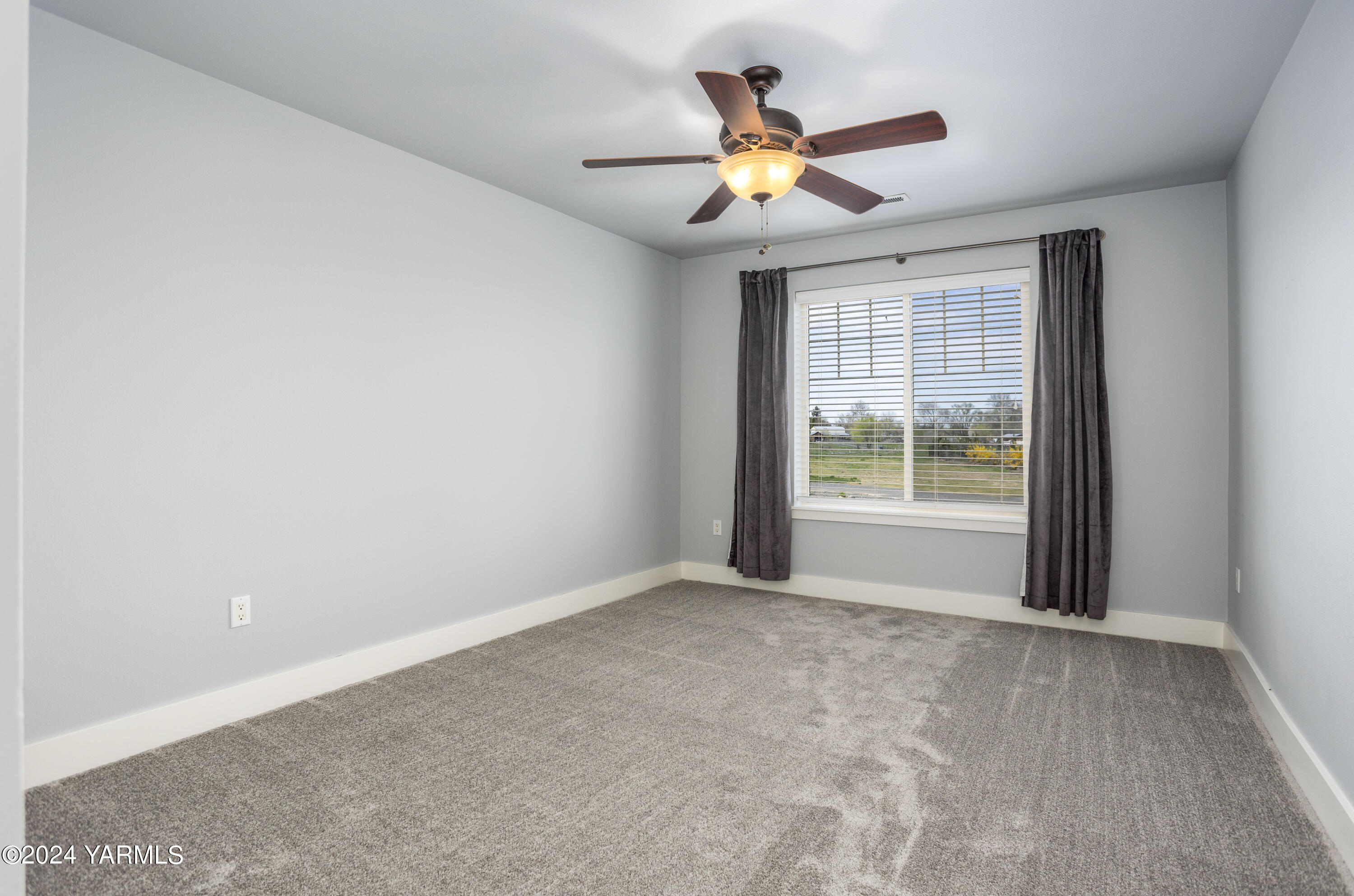 7115 1396 Private Road Southwest Prosser, WA 99350 - Photo 28 of 47 a view of an empty room with a window