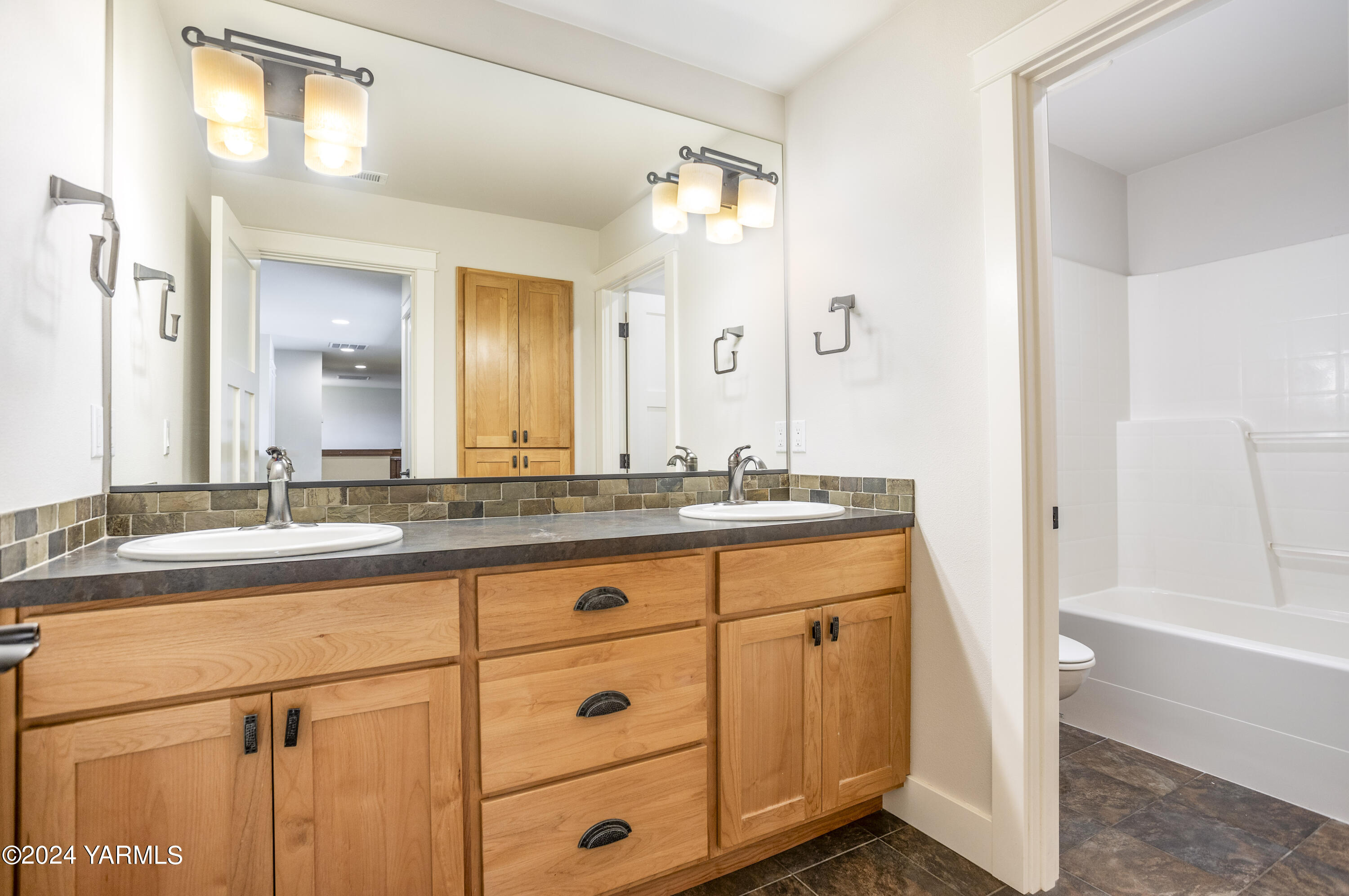 7115 1396 Private Road Southwest Prosser, WA 99350 - Photo 30 of 47 a bathroom with a granite countertop sink mirror and