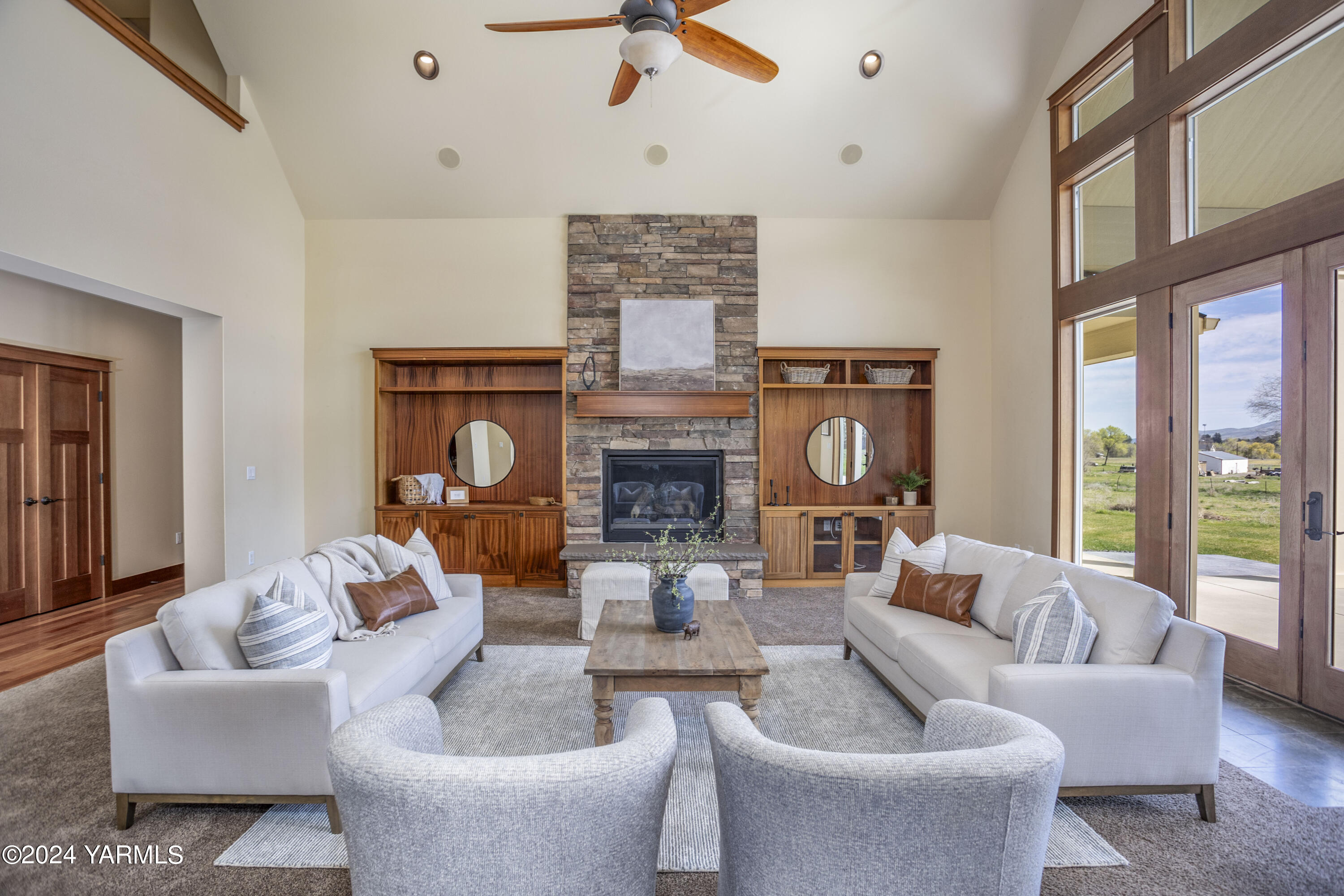 7115 1396 Private Road Southwest Prosser, WA 99350 - Photo 8 of 47 a living room with furniture a fireplace and a large window