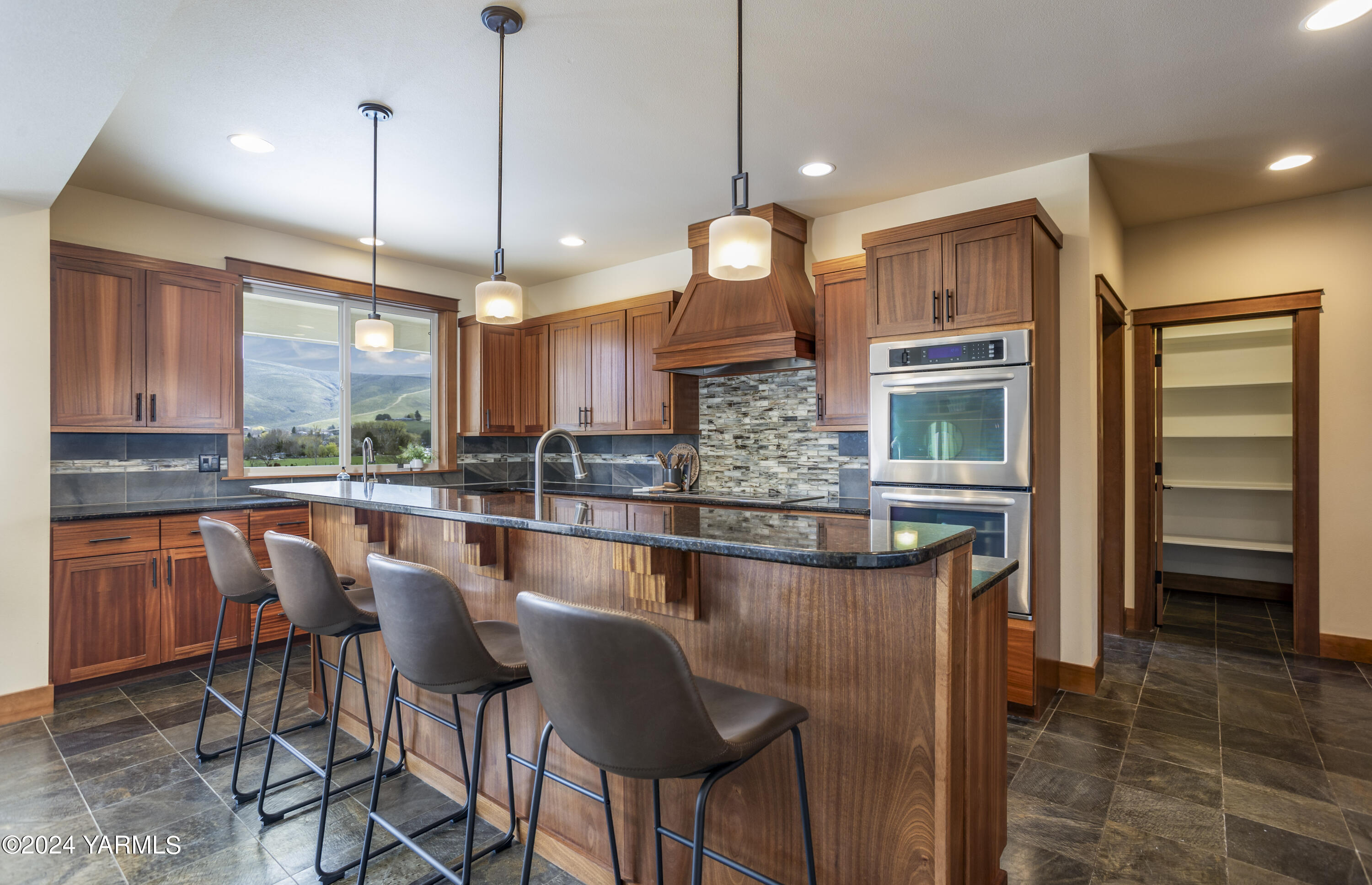 7115 1396 Private Road Southwest Prosser, WA 99350 - Photo 9 of 47 a kitchen with stainless steel appliances granite countertop counter space a sink and cabinets