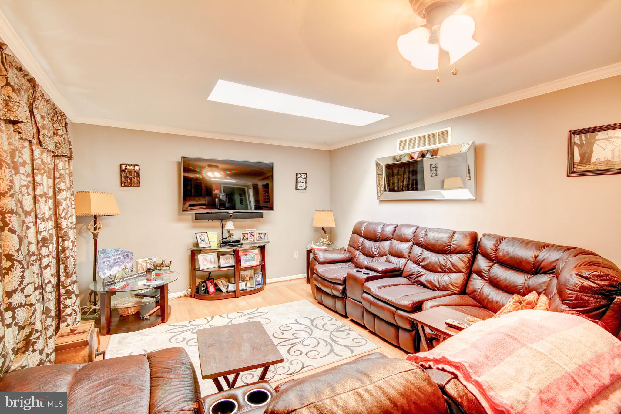 3450 Baker Road Westminster, MD 21157 - Photo 13 of 45 Living room w/hardwood floors and skylight