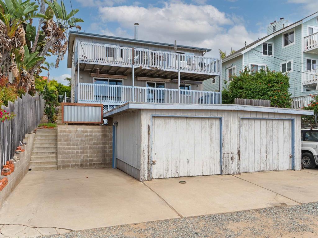 852 Dewitt Avenue Encinitas, CA 92024 - Photo 35 of 41 a house with large windows and plants