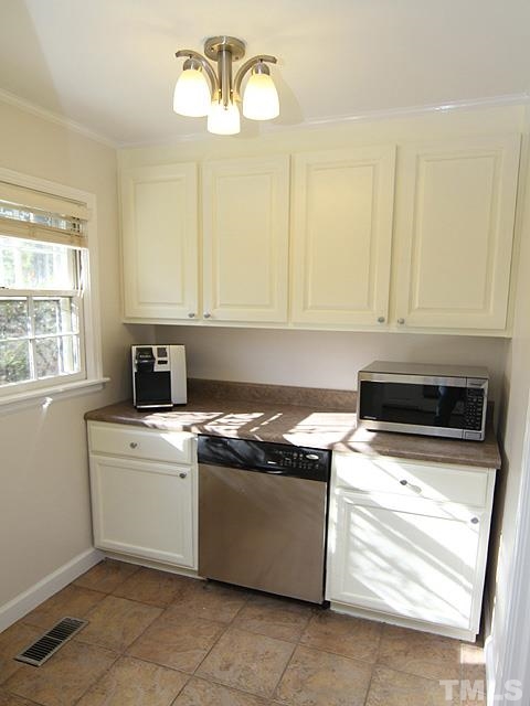 3819 Pickett Road Durham, NC 27705 - Photo 7 of 25 Butler's pantry gives more great kitchen space and additional storage.