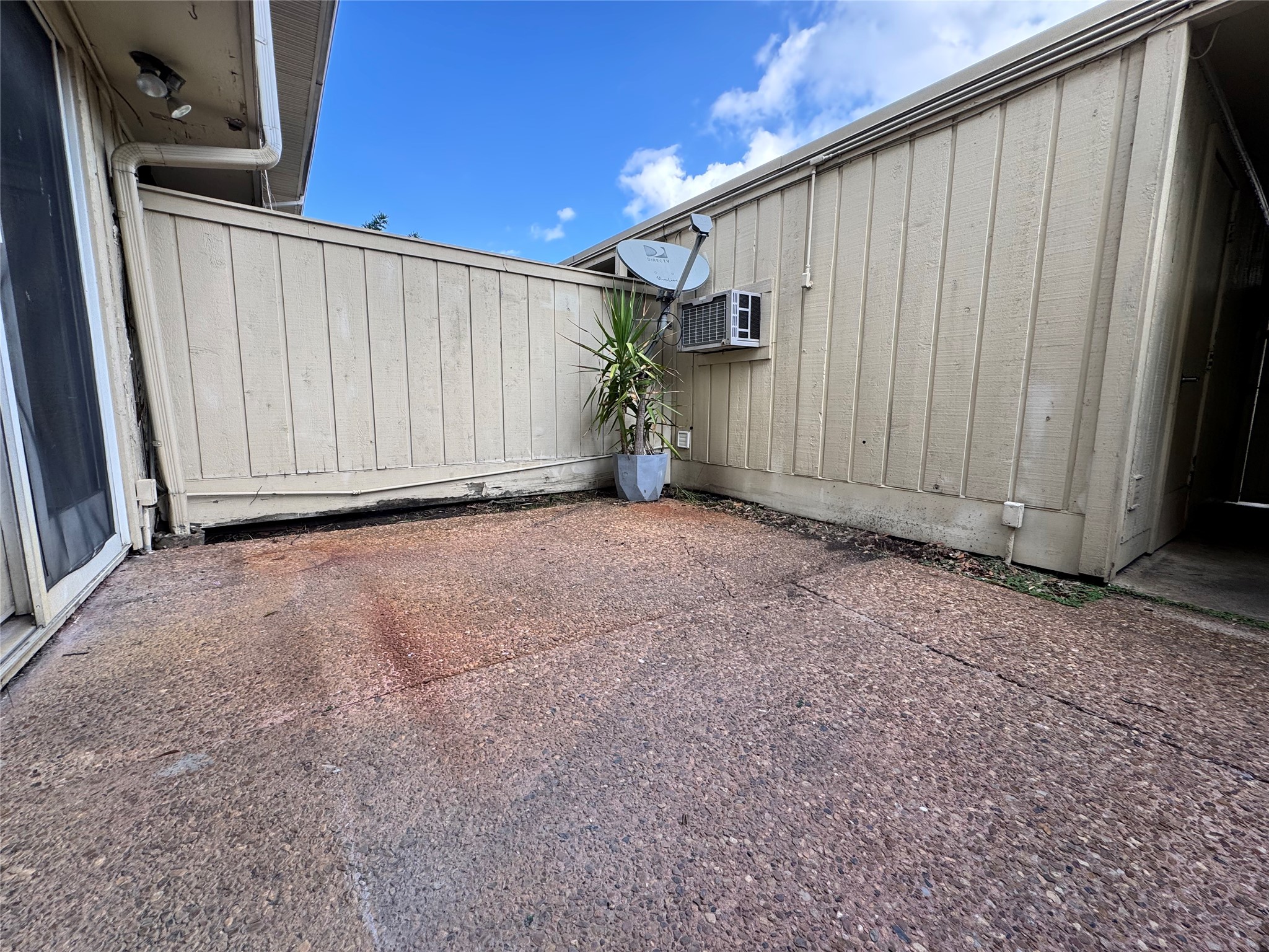 2041 Winrock Boulevard, Unit 157 Houston, TX 77057 - Photo 15 of 25 Relaxing patio between the generously sized situated between the living room and the garage with full enclosure for privacy and peace of mind.
