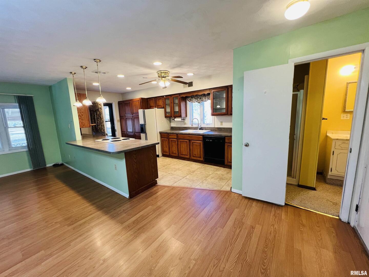295 Country Acres Road Eldorado, IL 62930 - Photo 21 of 32 a kitchen with stainless steel appliances granite countertop a refrigerator and a stove top oven