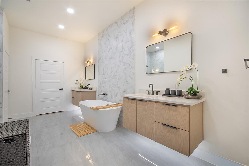 4648 Corregidor Street Dallas, TX 75216 - Photo 13 of 30 a bathroom with a double vanity sink mirror and bathtub