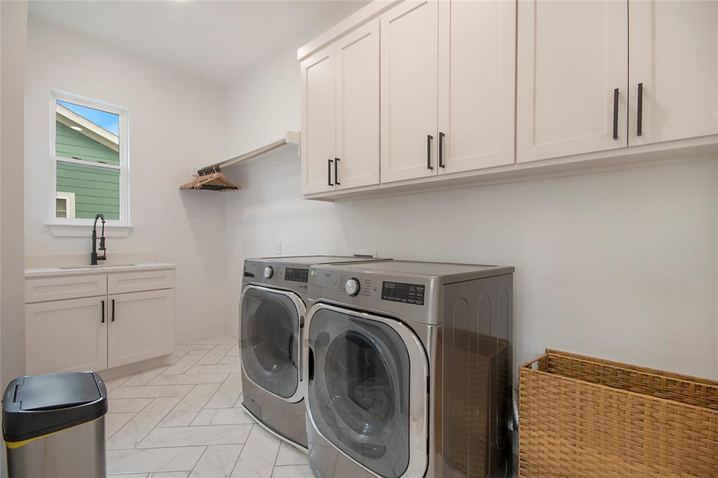 4648 Corregidor Street Dallas, TX 75216 - Photo 16 of 30 a utility room with sink dryer and washer
