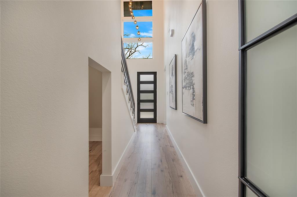 4648 Corregidor Street Dallas, TX 75216 - Photo 2 of 30 a view of a hallway with wooden floor and entryway