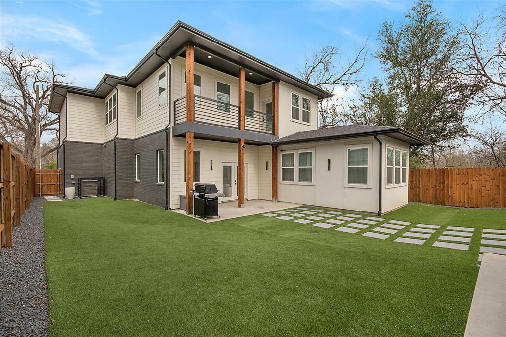 4648 Corregidor Street Dallas, TX 75216 - Photo 29 of 30 a view of a house with a yard and sitting area