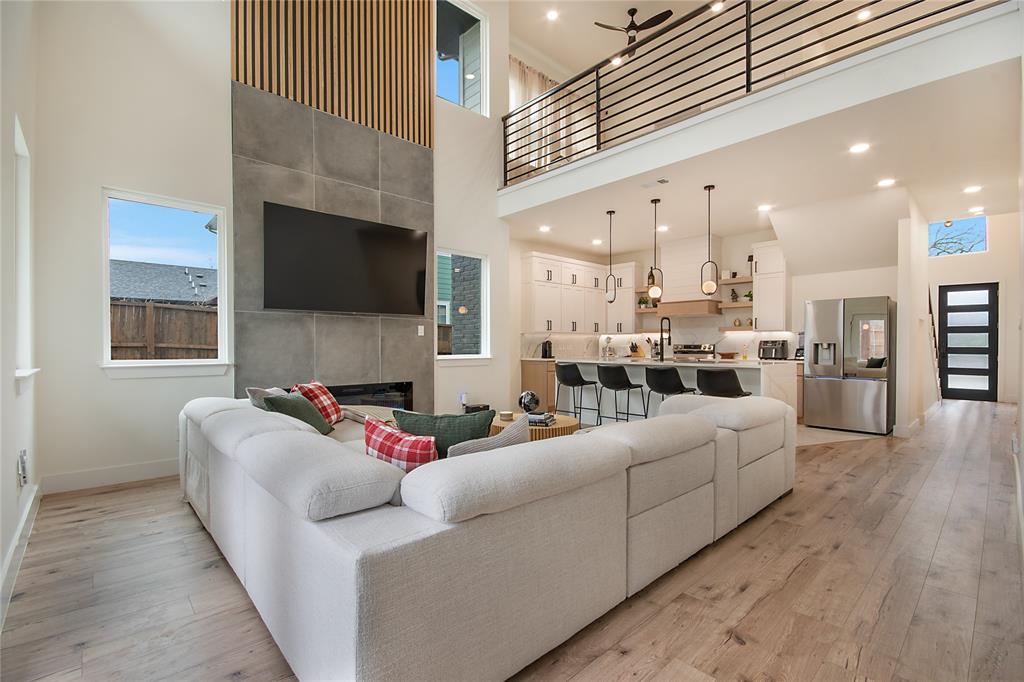 4648 Corregidor Street Dallas, TX 75216 - Photo 5 of 30 a living room with furniture and a flat screen tv