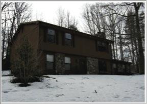 153 Ridgeview Road Blue Ridge, VA 24064 - Photo 1 of 1 a black house that has tree in front of it