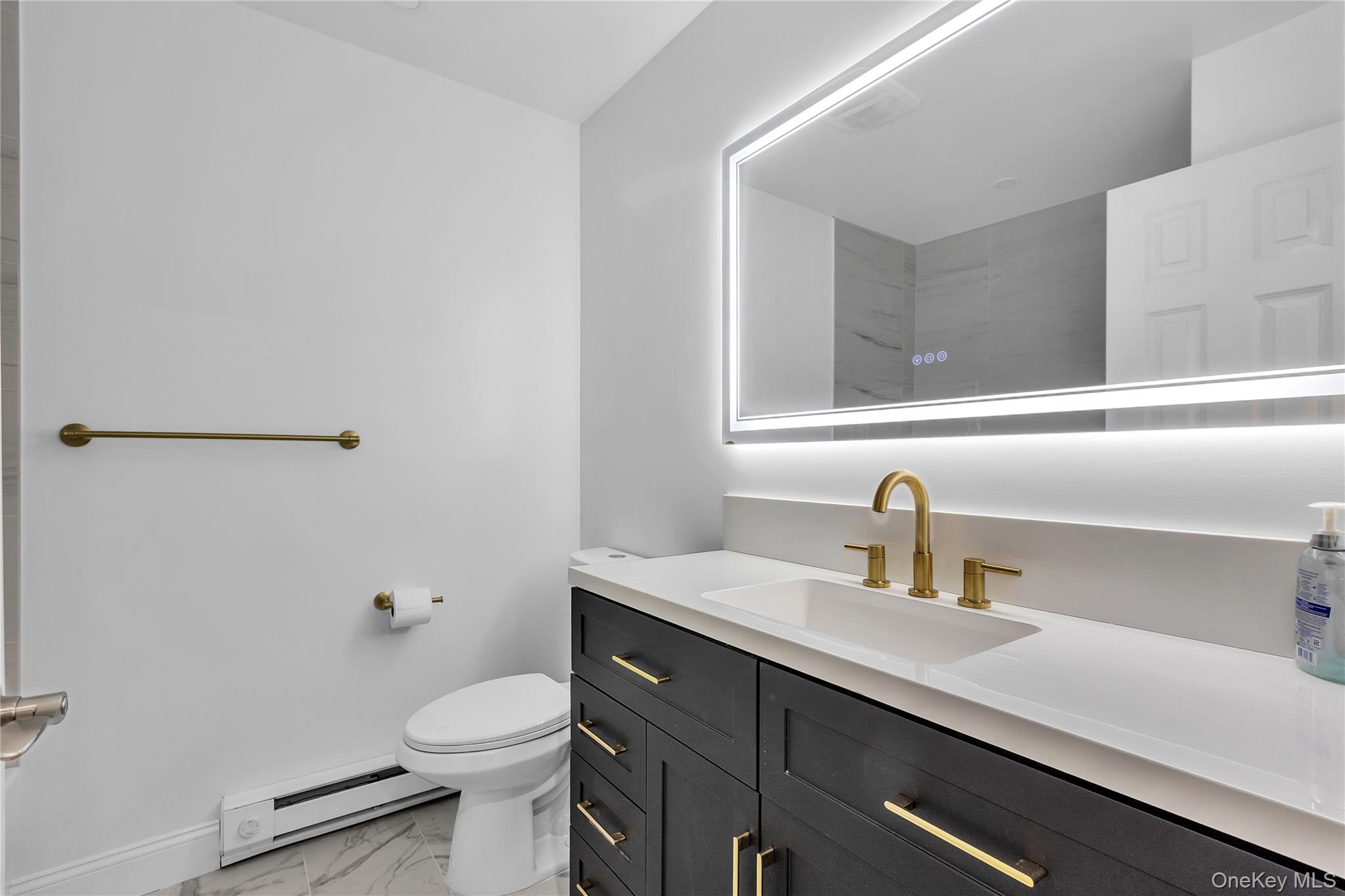 43 Park Road Goldens Bridge, NY 10526 - Photo 13 of 27 a bathroom with a sink a toilet and mirror